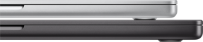 Two Apple laptops sitting on top of each other, the grey laptop on top is slightly smaller than the black laptop below.