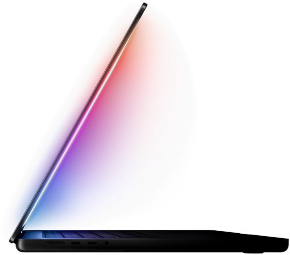 Una MacBook Pro ligeramente abierta proyecta un brillo multicolor desde la pantalla hacia el teclado.